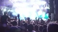 Enthusiastic crowd rejoicing and filming on mobile phones live music concert HD Footage