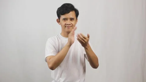 Enthusiastic man happily clapping hands Video stock 318686974