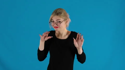 Enthusiastic model throws up hands expressing confusion Stock Footage 306474896