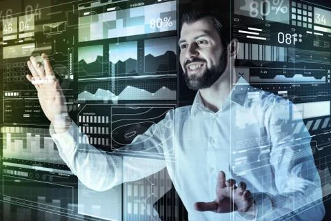 Enthusiastic programmer feeling glad while touching the screen of his computer Foto stock