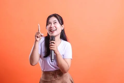 Enthusiastic Singer Pointing Upwards Stock Photos