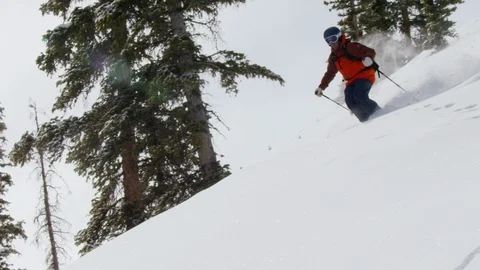 Enthusiastic skier skiing down the steep mountain slope during winter Stock Footage 116786001