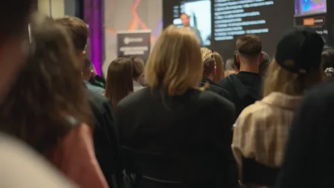 Enthusiastic young crowd delves into creative self-growth at interactive Video stock 270531751