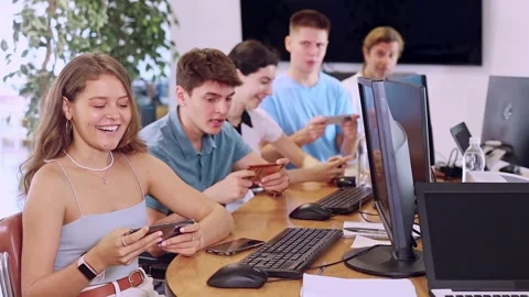 Enthusiastic young girl undergoing training in mobile applications development Stock Footage 344838717