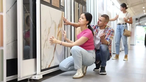 Enthusiastic young interracial couple browsing together technical and natural Stock Footage 341429598