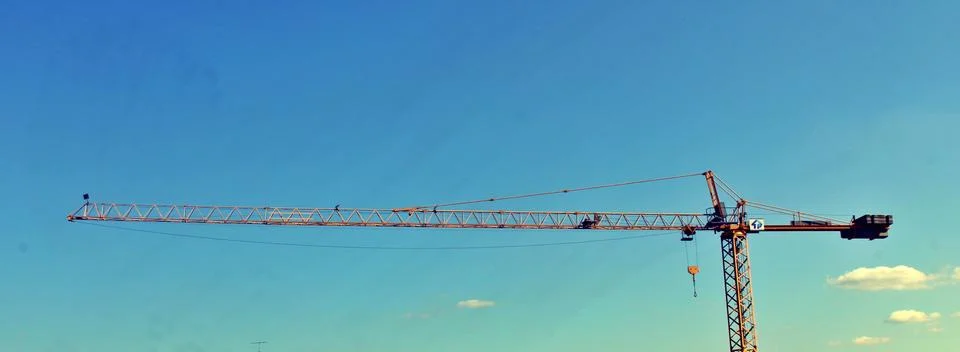 Entire view of a tower crane while construction Фото