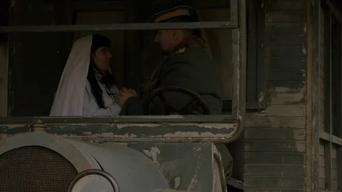 Entourage of first World War - officer and nurse keeping hands of each other Stock Footage 70677035