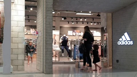Entrance of Adidas sportswear shop Stock Footage