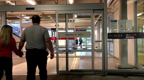 Entrance automatic glass door inside Ikea store Stock Footage 63382599