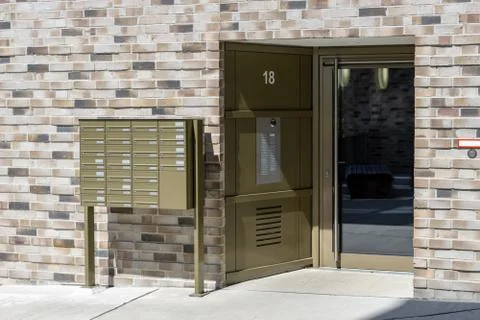Entrance of a building with postboxes Stock Photos