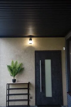 Entrance door to the house with a rectangular window. Stock Photos