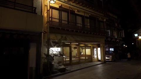 Entrance of hot spring resort at night Stock Footage