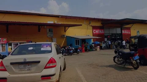 Entrance or front view and parking lot of China Mall in Kumasi, Ghana. Stock Footage 313772745