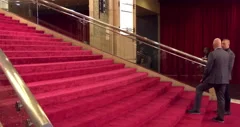 red carpet entrance camera flashes