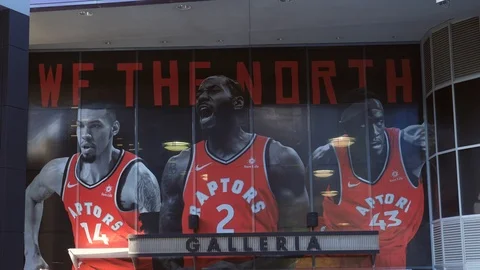 Entrance to Scotiabank Arena with members of NBA team Toronto Raptors. Stock Footage