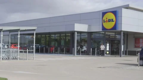 Entrance of a supermarket of a German food chain Stock Footage