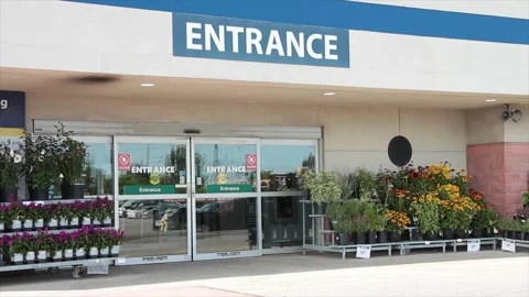Entrance writing caption text facade sign word in white on blue outside exterior Stock Footage 250274475