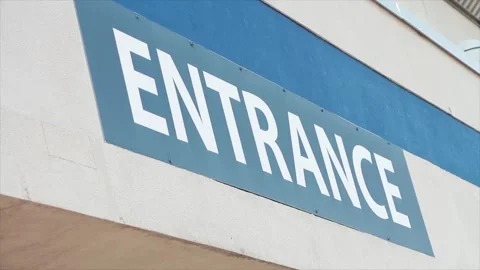 Entrance writing caption text facade sign word in white on blue outside exterior Stock Footage 250275075