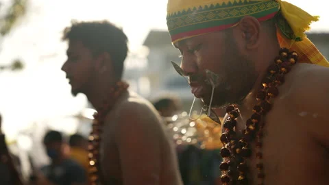 An Entranced Devotees Has His Cheeks And Tongue Skewered At Thaipusam Festival Stock Footage 234047315