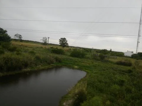 Entre Rios, Argentina; December 4 2021: A picture of a river with clouds in t Stockfoto's