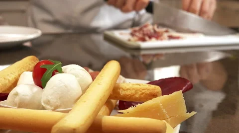 Entree, appetizer, starter: salami, cheese and mozzarella and cherry tomatoes Stock-Footage 61352397