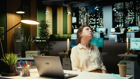 Entrepreneur contemplating on a complex problem in a dark office late at night Stock Footage 317965270