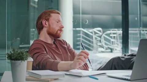 Entrepreneur in Doubt. Man Stares at Computer Deep in Thought at Office Stock Footage 307073883