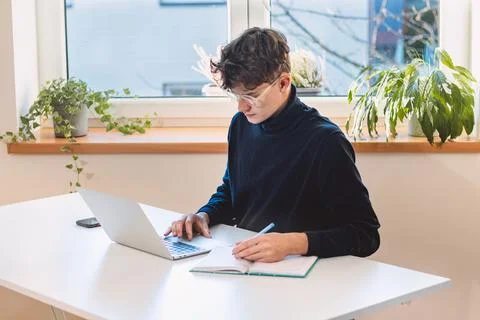Entrepreneur in his study by the window is thinking of a new concept and stra Stock Photos