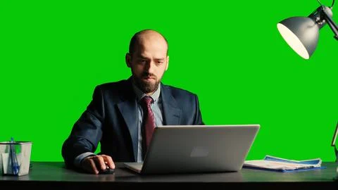 Entrepreneur looking at data on isolated greenscreen Stock Photos