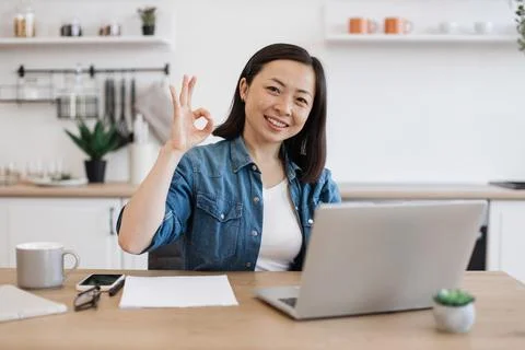 Entrepreneur looking for data on webpages via laptop at home Stock Photos