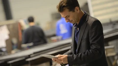 Entrepreneur in manufacture using tablet Stock Footage 45665195
