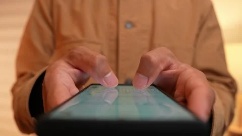 An entrepreneur types on a smartphone. Stock Footage 317599497
