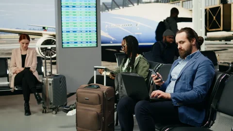 Entrepreneur typing on laptop and checking mobile phone screen Stock Footage 339643232
