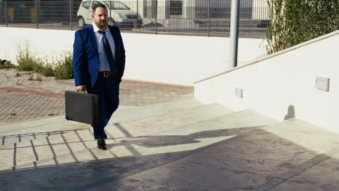 Entrepreneur Walking Up The Steps Of The Park Stock Footage 310690416