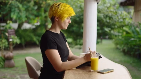 Entrepreneur woman using tablet to work on her personal project - slow motion Stock Footage 210799262