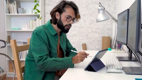 Entrepreneur working with computer digital tablet stylus pen and color swatch 動画素材 235553204