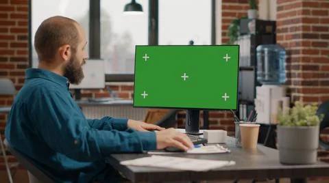 Entrepreneur working with green screen on computer Stock Photos