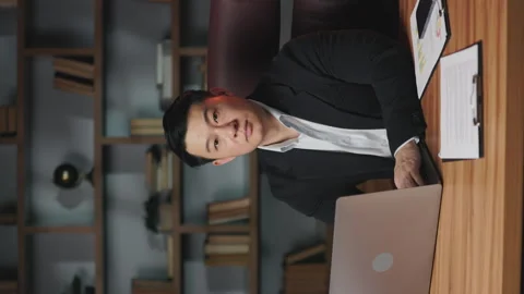 Entrepreneur working on portable computer at desk in office Vidéo 246405299