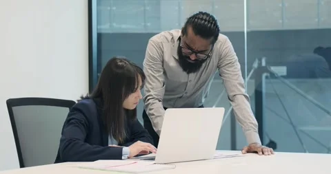Entrepreneurial Pair Tackling Work Tasks in Modern Office Stock Footage 250028562