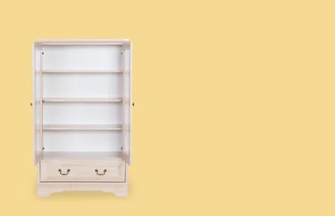 Entry open white cabinet isolated on yellow background with space for copy. Stock Photos