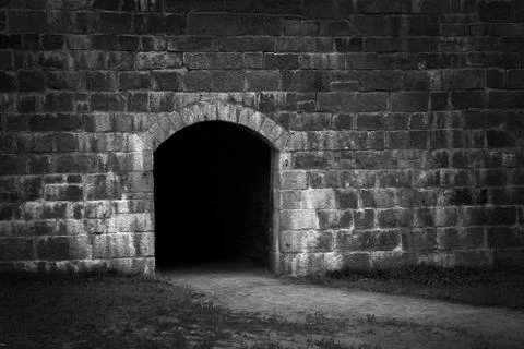 Entry in stone wall Stock Photos