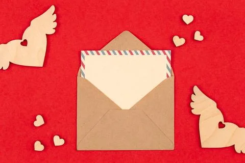 Envelope and blank postcard on a red background, Valentine's Day. Stock Photos
