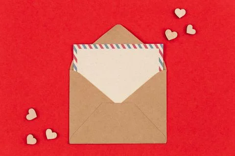 Envelope and blank postcard on a red background, Valentine's Day concept. Stock Photos