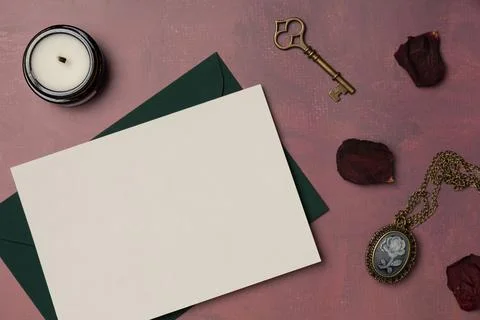 Envelope and empty white paper list with vintage feminine medallion, key, c.. Stock Photos