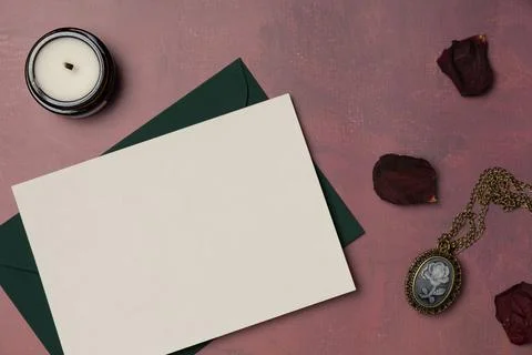 Envelope and empty white paper list with vintage feminine medallion, candle.. Stock Photos