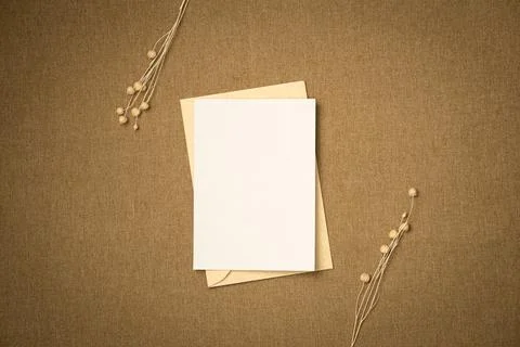 Envelope and paper blank sheet on fabric background from above. Space for tex Foto stock
