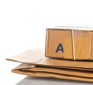 Envelope and parcel over white Stock Photos