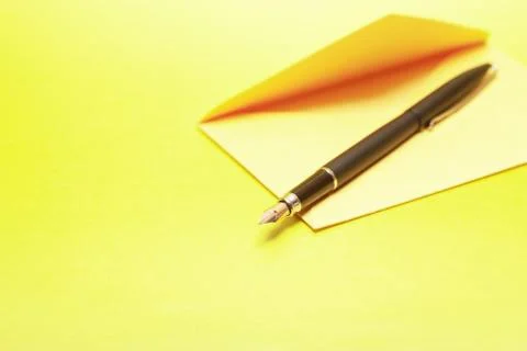 Envelope and pen Stock Photos