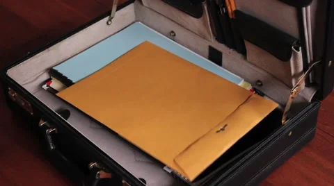 Envelope into Briefcase Video stock 44859301