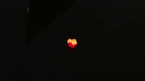 An envelope with a candle floats on the river 库存影片 128277379